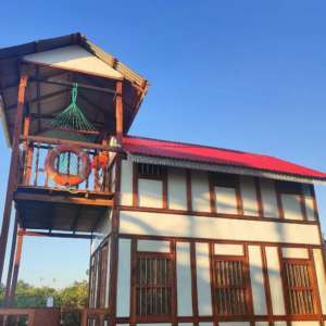 Duplex wooden cottage with private balcony and relaxing hammock